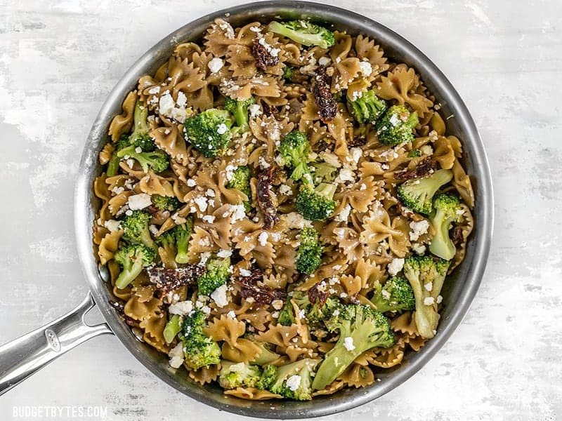 A few pantry staples come together to make a fantastic dinner in this fast, easy, and flavorful one Skillet Pasta with Sun Dried Tomatoes Walnuts and Feta. BudgetBytes.com Top Skillet Pasta with Sun Dried Tomatoes with feta cheese and lemon zest