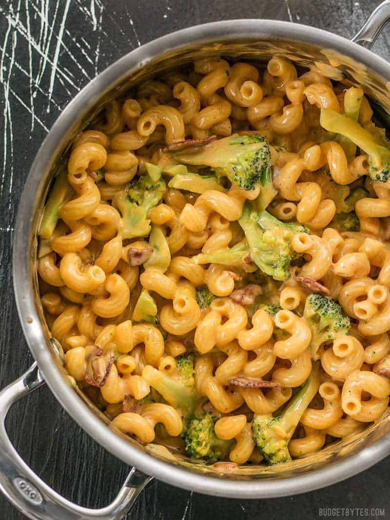 This One Pot Bacon Broccoli Mac and Cheese is fast, easy, and absolutely fool proof. This sauce stays smooth and creamy! BudgetBytes.com Overhead shot of the pot full of Bacon Broccoli Mac and Cheese