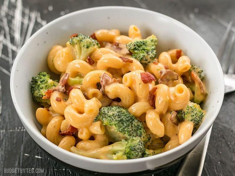 This One Pot Bacon Broccoli Mac and Cheese is fast, easy, and absolutely fool proof. This sauce stays smooth and creamy! BudgetBytes.com Front view of a bowl of One Pot Bacon Broccoli Mac and Cheese