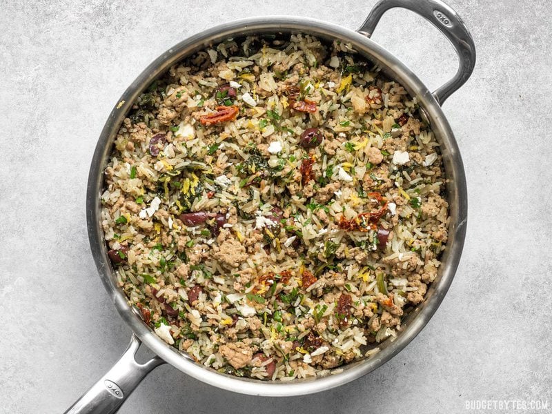 Greek Turkey and Rice Skillet is an easy and flavorful ground turkey recipe that cooks in one skillet for maximum flavor and minimum effort. Budgetbytes.com Greek Turkey and Rice Skillet finished with feta on top