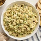 Overhead view of a bowl of chicken curry salad.