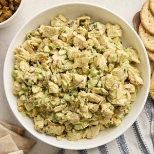 Overhead view of a bowl of chicken curry salad.