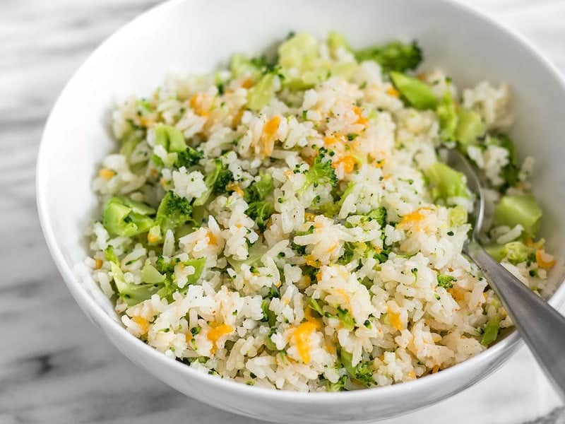 This Easy Cheesy Broccoli Rice is a fast and flavorful side when you don't have time to make a classic Broccoli Cheddar Casserole. BudgetBytes.com Front view of a bowl of Easy Cheesy Broccoli Rice