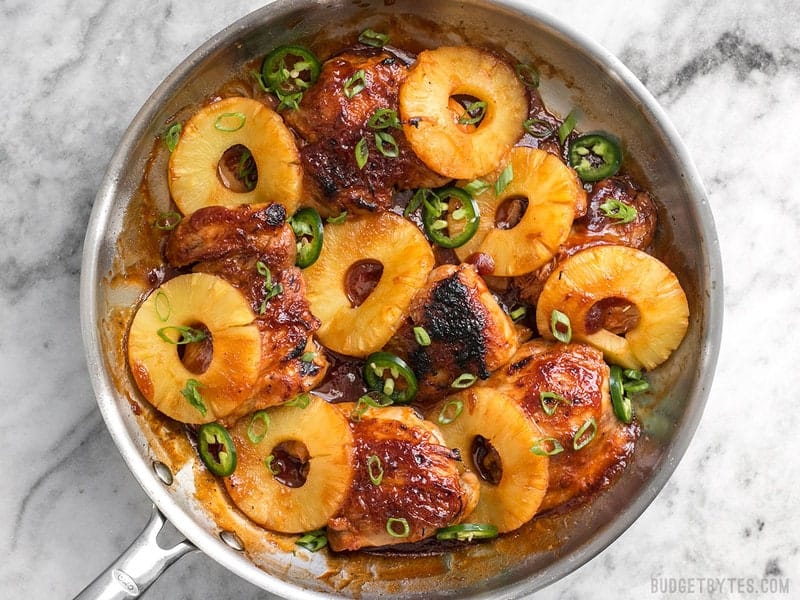 A quick pan sauce drenches tender chicken thighs and thick pineapple slices in this easy Skillet Pineapple BBQ Chicken Broiled chicken and pineapple in BBQ pan sauce