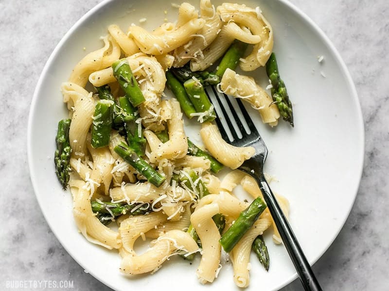 Lemon Garlic Asparagus Pasta is a fast, easy, and fresh weeknight dinner that you'll come back to again and again and have memorized in no time. BudgetBytes.com A half eaten bowl of Lemon Garlic Asparagus Pasta