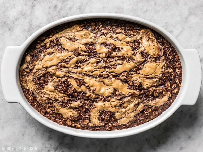 This Peanut Butter Brownie Baked Oatmeal is an indulgent-yet-healthy breakfast with rich chocolatey goodness and just a hint of sweetness. BudgetBytes.com Baked Peanut Butter Brownie Baked Oatmeal