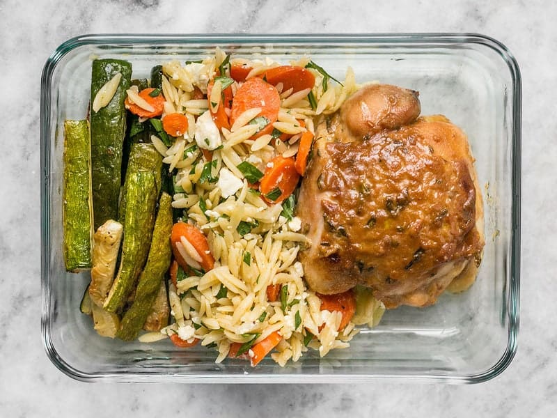 This week's Maple Dijon Chicken Thigh Meal Prep is all about oven roasting, fall flavors, and lots of vegetables. BudgetBytes.com Overhead shot of one Maple Dijon Chicken Thigh Meal Prep container
