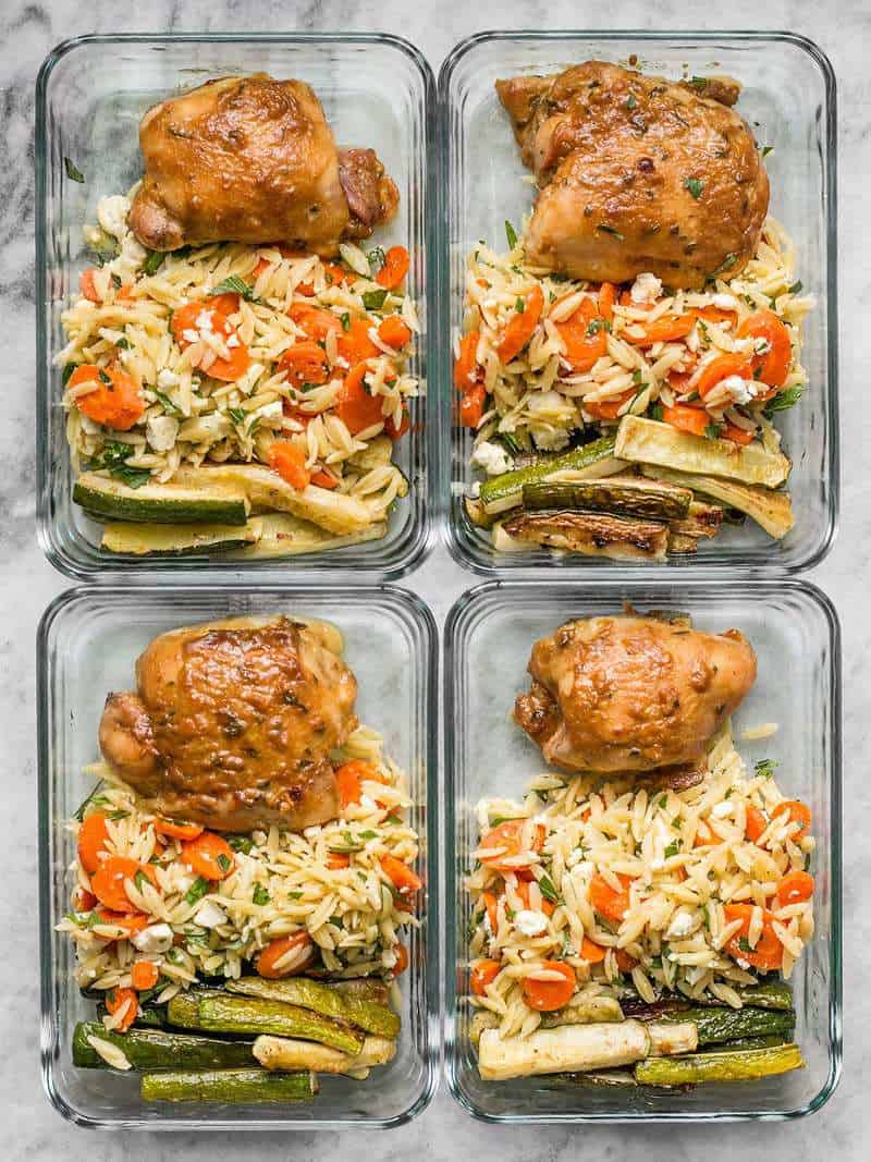 This week's Maple Dijon Chicken Thigh Meal Prep is all about oven roasting, fall flavors, and lots of vegetables. BudgetBytes.com Four Maple Dijon Chicken Thigh Meal Prep containers lined up