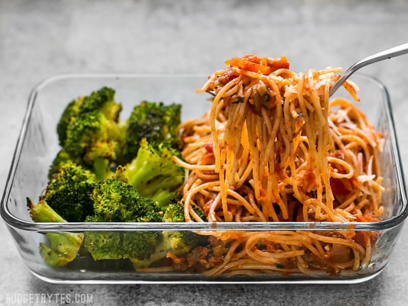 This simple Spaghetti Meal Prep is hiding a ton of good-for-you vegetables in a classic comforting dish. BudgetBytes.com A Spaghetti Meal Prep being eaten with a fork