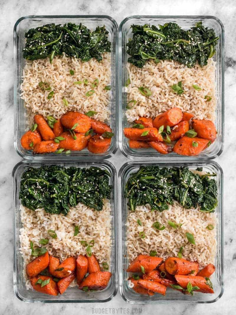 This Maple Miso Roasted Carrot Meal prep is easy, healthy, has tons of flavor, and plenty of ways to customize! BudgetBytes.com Four glass Maple Miso Roasted Carrot Meal prep containers
