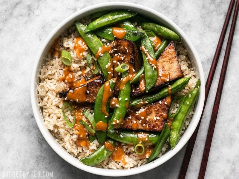 These vegan Soy Marinated Tofu Bowls are full of rich flavors and plenty of texture to keep your taste buds happy and your belly full. BudgetBytes.com