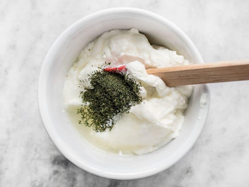 Combining the dill yogurt sauce ingredients.