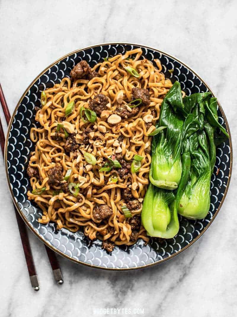 Sweet, salty, rich, and crunchy, these Pork and Peanut Dragon Noodles hit all the bases. It’s fast, easy comfort food for busy nights! BudgetBytes.com Pork and Peanut Dragon Noodles with steamed bok choy on the side