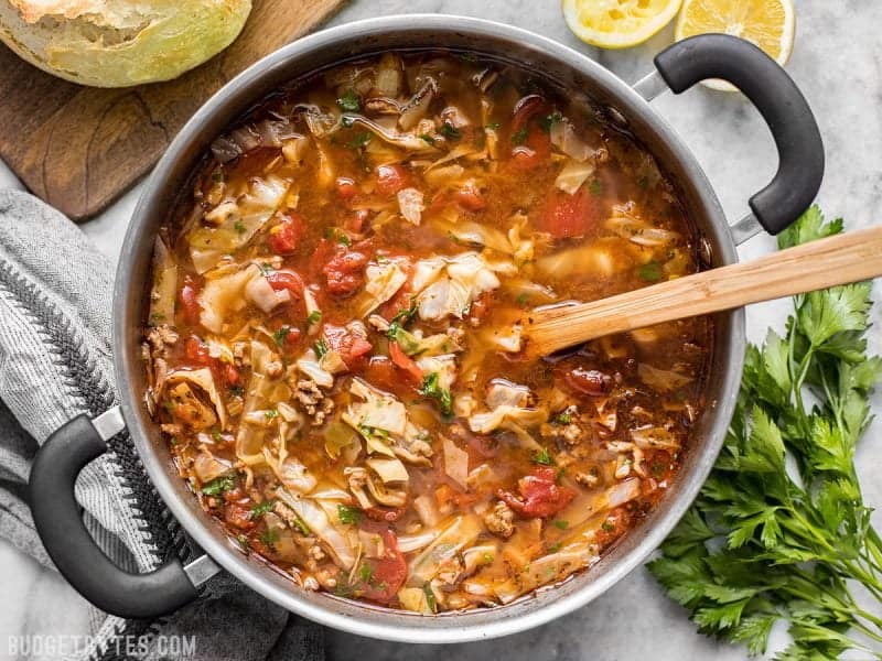 Light, but filling, this Beef and Cabbage Soup will fill you up without weighing you down, and will keep you warm from the inside out. BudgetBytes.com Finished Beef and Cabbage Soup with a wooden spoon