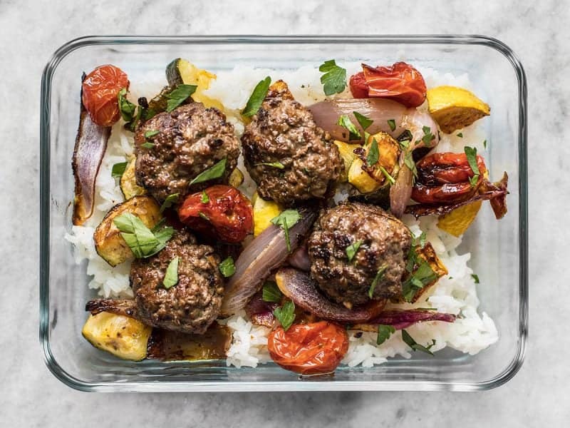Beef Kofta Meatballs with Roasted Vegetables are the perfect well-rounded easy dinner or meal prep to keep you fed and happy throughout the week. BudgetBytes.com Beef Kofta Meatballs in a meal prep container with rice