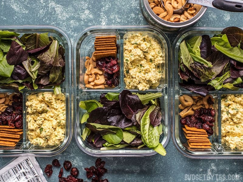 Light, filling, full of texture and flavor, this no-reheat Curried Tofu Salad Meal Prep is the perfect make-ahead lunch for summer! Budgetbytes.com Three Curried Tofu Salad Meal Prep containers in a row
