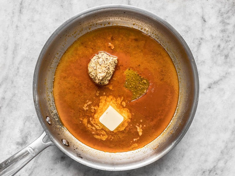 Add butter, mustard, and honey to skillet.