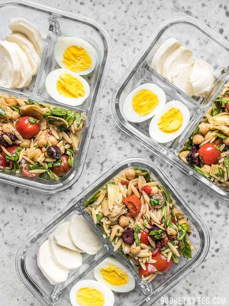Orzo Salad Meal Prep Cold Lunch Boxes - Budgetbytes.com Orzo Salad Meal Prep Lunch Boxes scattered view