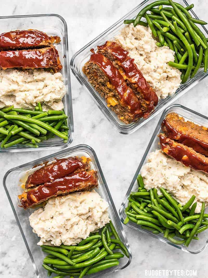 This Cheeseburger Meatloaf Meal Prep is an easy American classic meal that you'll look forward to each day. Toss the TV dinners and make your own! Budgetbytes.com Containers of Cheeseburger Meatloaf Meal Prep