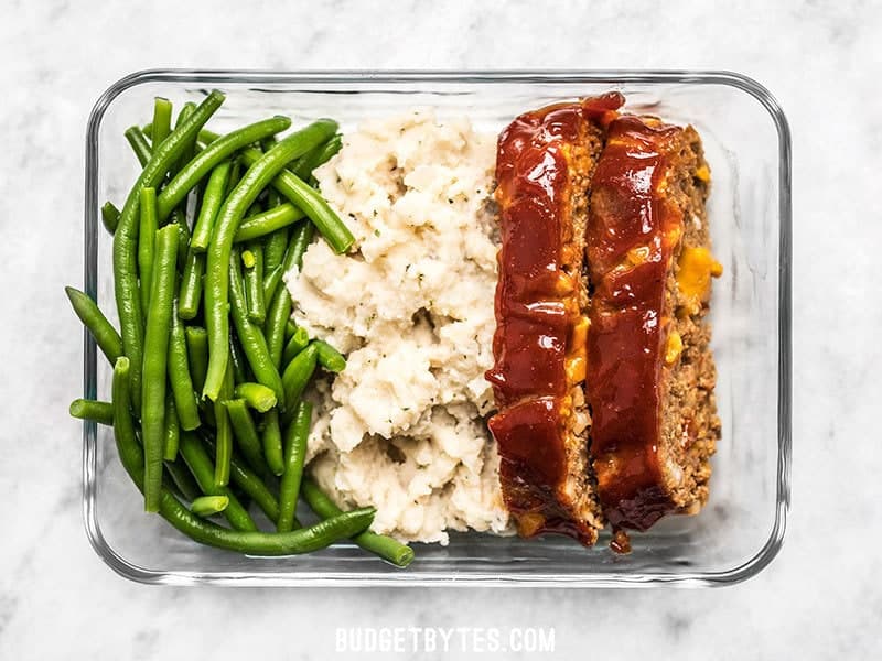 This Cheeseburger Meatloaf Meal Prep is an easy American classic meal that you'll look forward to each day. Toss the TV dinners and make your own! Budgetbytes.com One single Cheeseburger Meatloaf Meal Prep box