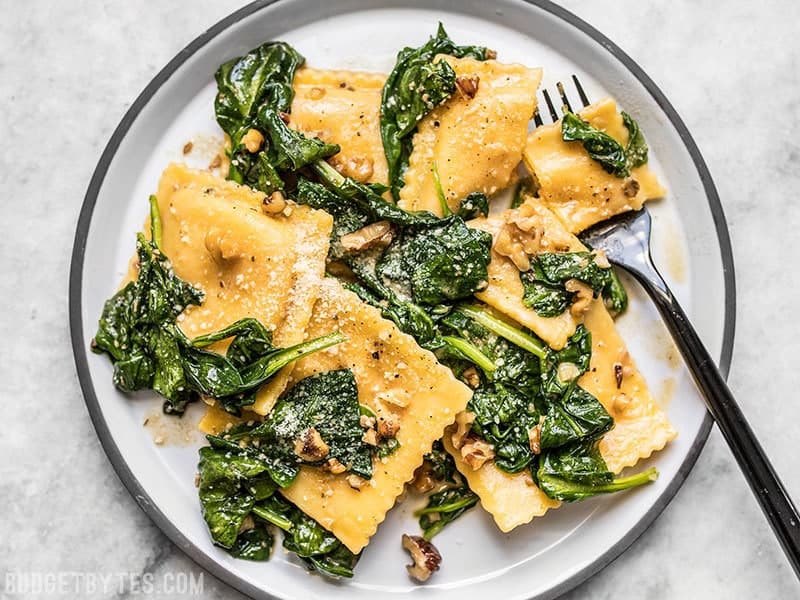 Do something special for yourself and make this simple, yet elegant Ravioli with Sage Brown Butter Sauce. Restaurant quality without the enormous bill! Budgetbytes.com Close up of Ravioli with Sage Brown Butter Sauce