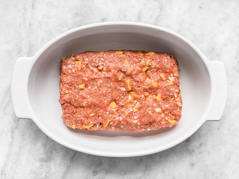 Shaped Cheddar Cheeseburger Meatloaf in a Casserole Dish.