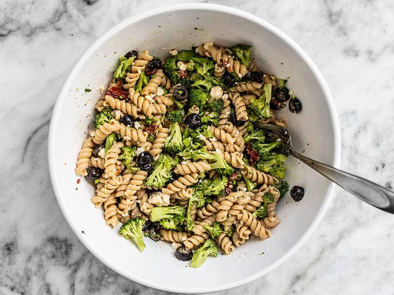 Throw together meals like this "Sweep the Kitchen" Pasta Salad are my favorite way to use up leftovers in the kitchen. Easy, versatile, and never boring! Budgetbytes.com Finished Sweep the Kitchen Pasta Salad