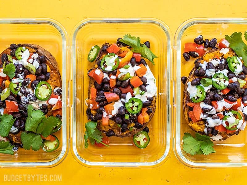 Loaded Sweet Potatoes are the perfect pre-portioned item for your weekly meal prep. They reheat well and can be customized to fit your needs. Budgetbytes.com Loaded Sweet Potatoes in Glass Meal Prep Containers