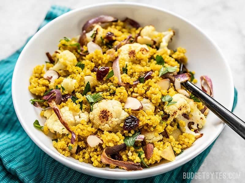 This Roasted Cauliflower and Quinoa Salad holds up well in the refrigerator for days, making it perfect for meal prep or brown bagging your lunch. Budgetbytes.com Front view of the bowl of Roasted Cauliflower and Quinoa Salad