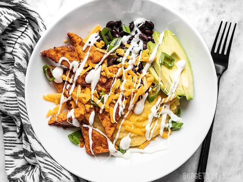 Sweet and Spicy Tempeh Bowls are the perfect make-ahead vegetarian meal prep, with a medley of colors, textures, and bold flavors. Budgetbytes.com A prepared Sweet and Spicy Tempeh Bowl with ranch drizzle.