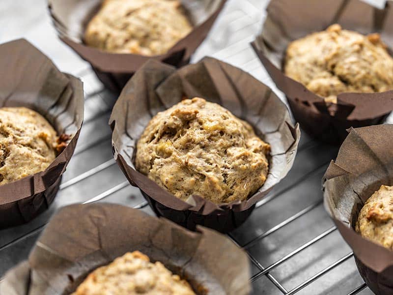 Mashed banana keeps these Banana Flax muffins soft, sweet, and moist without using a ton of added sugar or oil. This is a breakfast muffin you can feel good about! Budgetbytes.com Close up shot of Banana Flax Muffins in paper liners