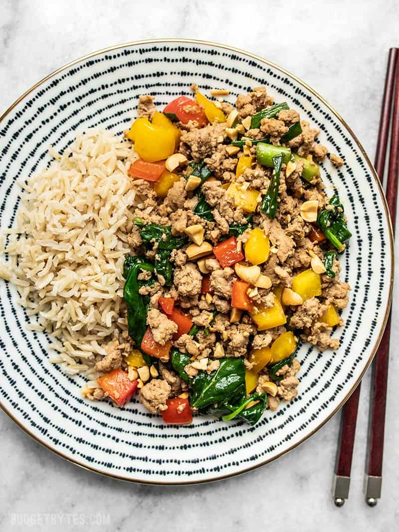This super easy Ground Turkey Stir Fry is a delicious and versatile answer to busy weeknight dinners. Try the suggested variations to make it your own! Budgetbytes.com A patterned plate full of Ground Turkey Stir Fry and brown rice.