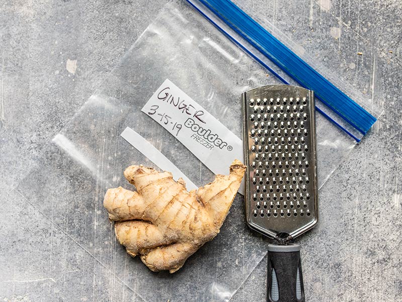 Reducing waste is critical to keeping a food budget. Here are 10 foods I freeze on a regular basis to save money and reduce waste in my kitchen. Budgetbytes.com Fresh ginger root next to a cheese grater, laying on a freezer bag.