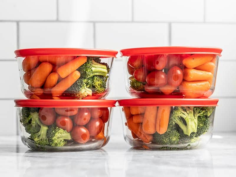 Make healthy snacking fast, easy, and hard to ignore with pre-packed veggie snack packs! Change up the vegetables and dressing each week for variety. Budgetbytes.com Closed containers full of veggie snack packs, stacked in sets of two