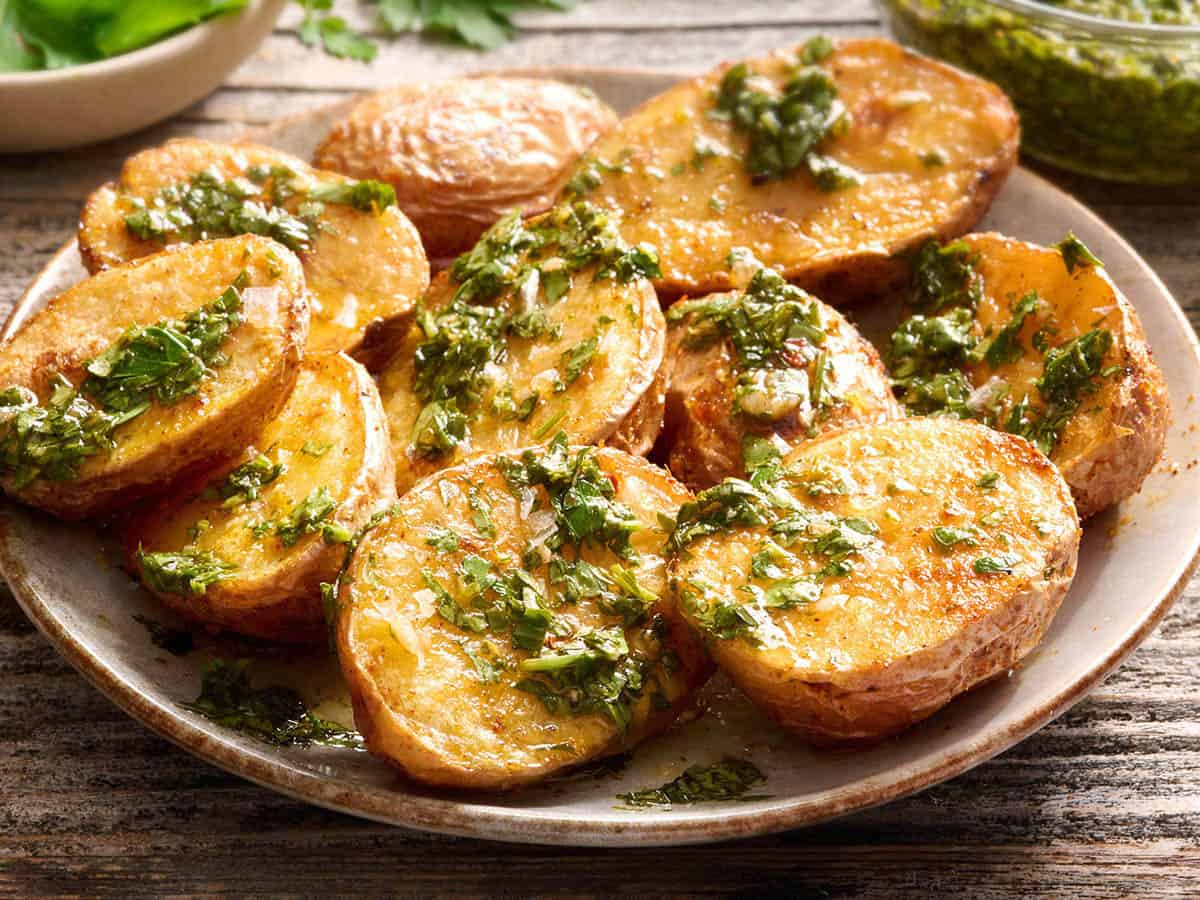 Chimichurri sauce drizzled on air fryer potatoes.