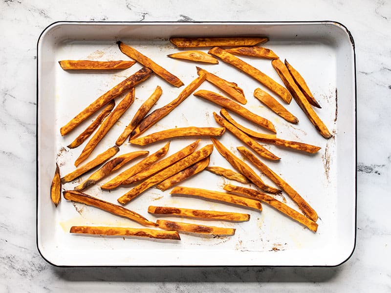Baked sweet potato fries on the baking sheet