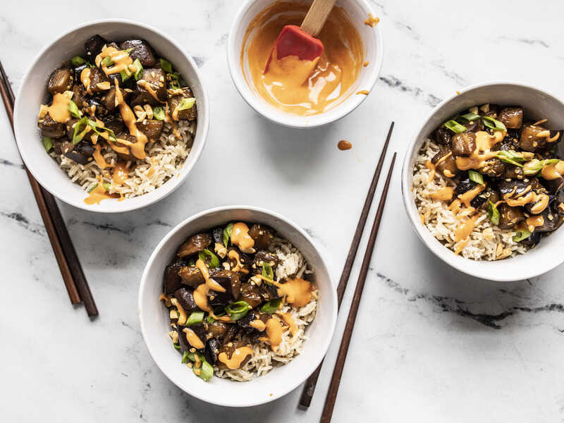 This Soy Glazed Eggplant stir fry is a super fast and easy vegetarian weeknight dinner, which also meal preps well for the week. BudgetBytes.com Sriracha Mayo drizzled over three bowls Soy Glazed Eggplant