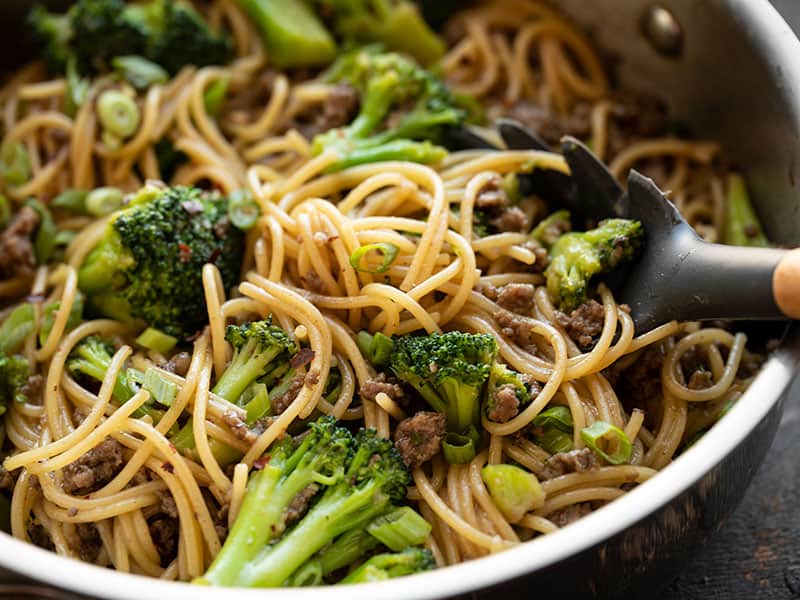 Garlic Noodles with Beef and Broccoli is a quick and easy all-in-one bowl dinner recipe with a rich, buttery, salty, and sweet sauce. BudgetBytes.com Close up of Garlic Noodles with Beef and Broccoli in the skillet