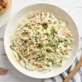 Overhead view of a bowl of creamy coleslaw.