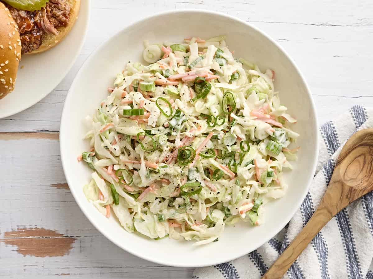 Overhead view of a bowl of creamy coleslaw.