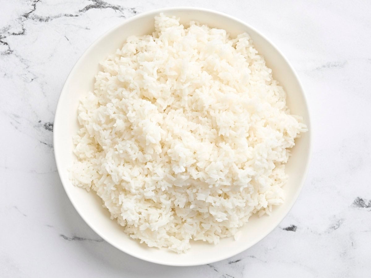 A plate of cooked white rice.