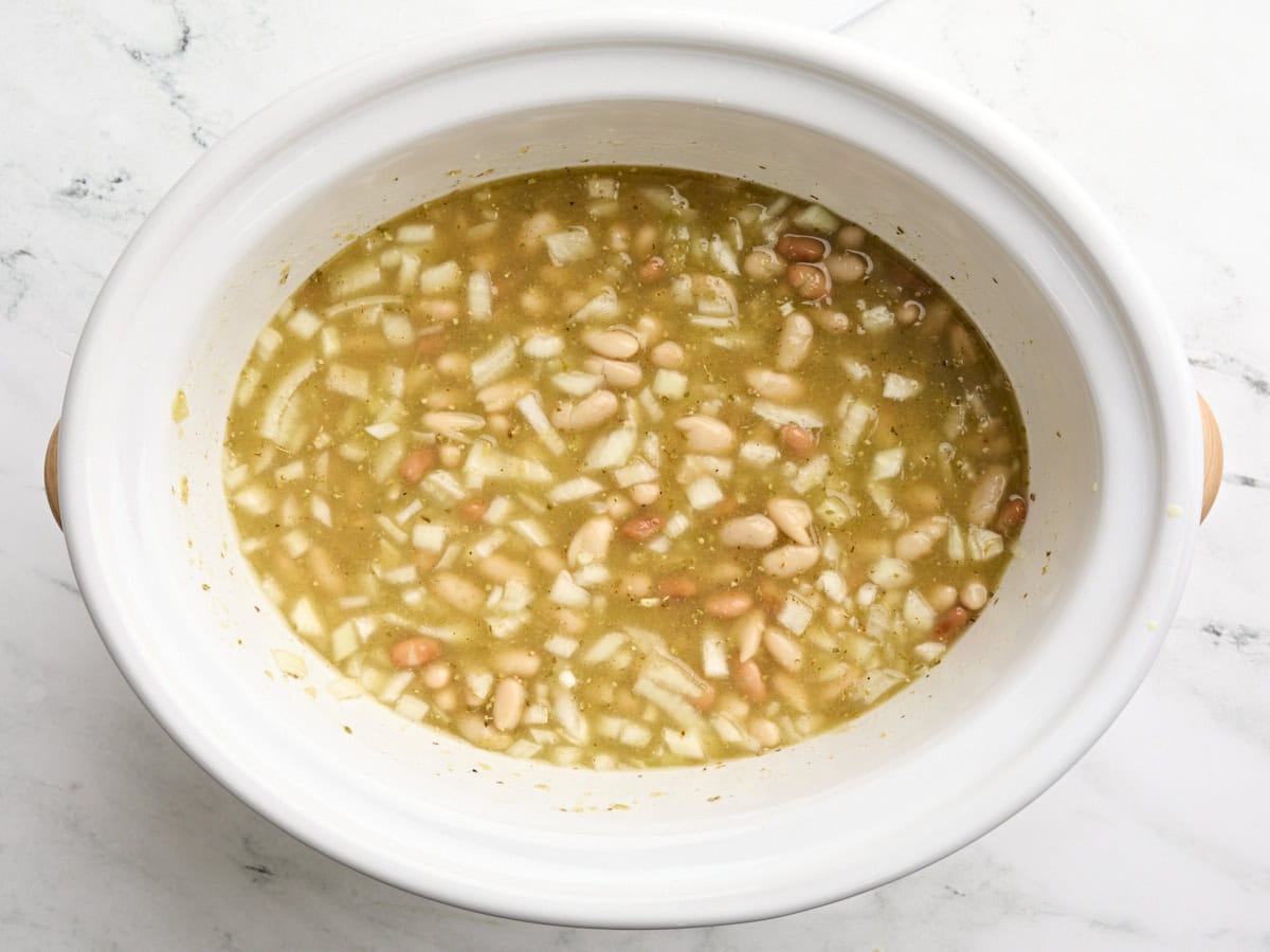 Slow cooker white chicken chili in a crockpot before cooking.