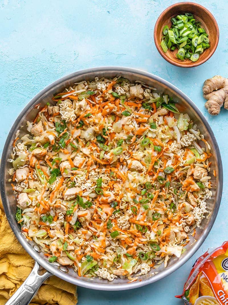 Crunchy Chicken Ramen Stir Fry is an easy weeknight dinner with tons of cabbage and carrots, crunchy crushed ramen, and a creamy sriracha drizzle. BudgetBytes.com Finished skillet full of Crunchy Chicken Ramen Stir Fry