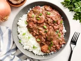 Overhead view of New Orleans-style red beans and rice on a plate.
