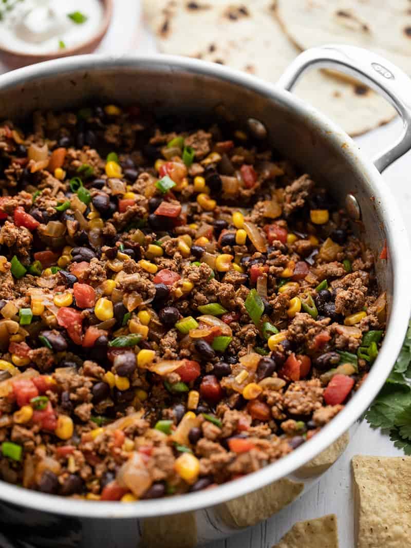 This easy and versatile Turkey Taco Skillet takes about 20 minutes to make, is freezer friendly, and can be served several different ways. BudgetBytes.com Close up side view of the turkey taco skillet