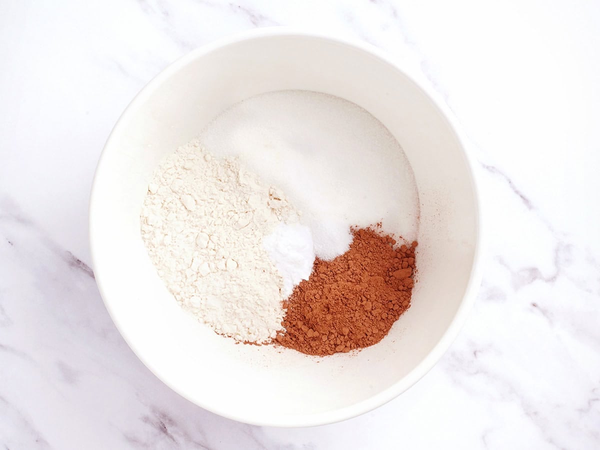 The dry ingredients for chocolate depression cake in a bowl.