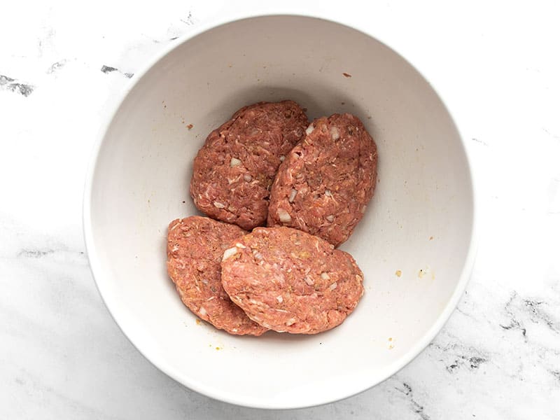Shaped Salisbury Steak patties in a bowl