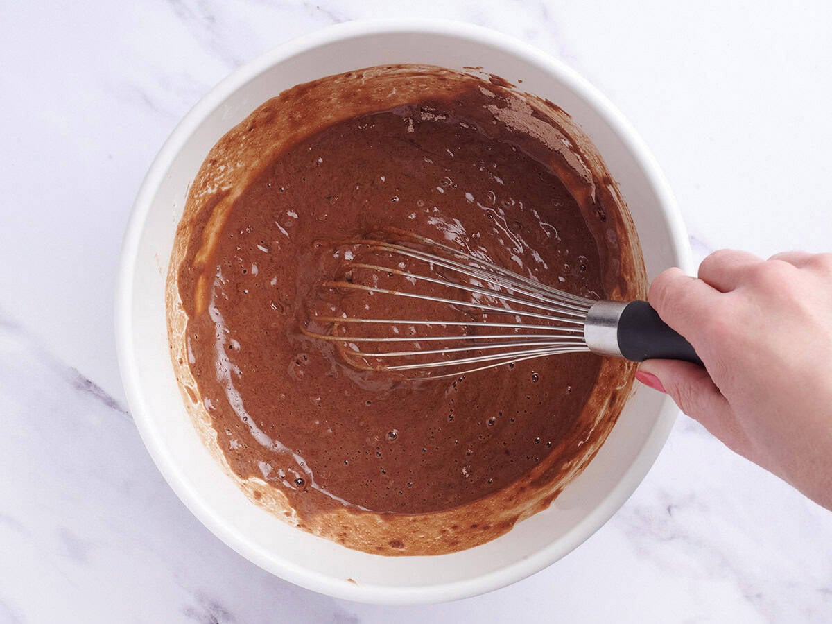 Chocolate depression cake batter in a mixing bowl.