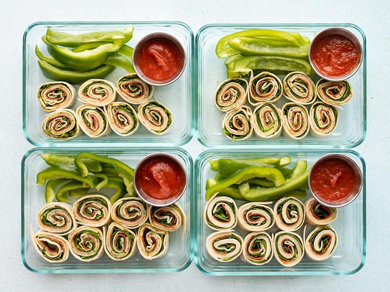 These easy pizza roll up lunch boxes are a great no-cook lunch idea for your work week. No reheating required for this lunch meal prep! Budgetbytes.com Finished pizza roll up lunch boxes