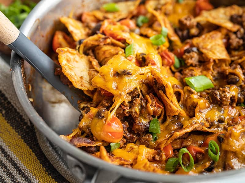 This Beef Taco Skillet can repurpose your leftover ingredients into a fast, easy, and hearty weeknight dinner. Budgetbytes.com Close up of Beef Taco Skillet with a spatula scooping some out of the side